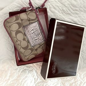 Brand new Coach Poppy Wristlet with original box
